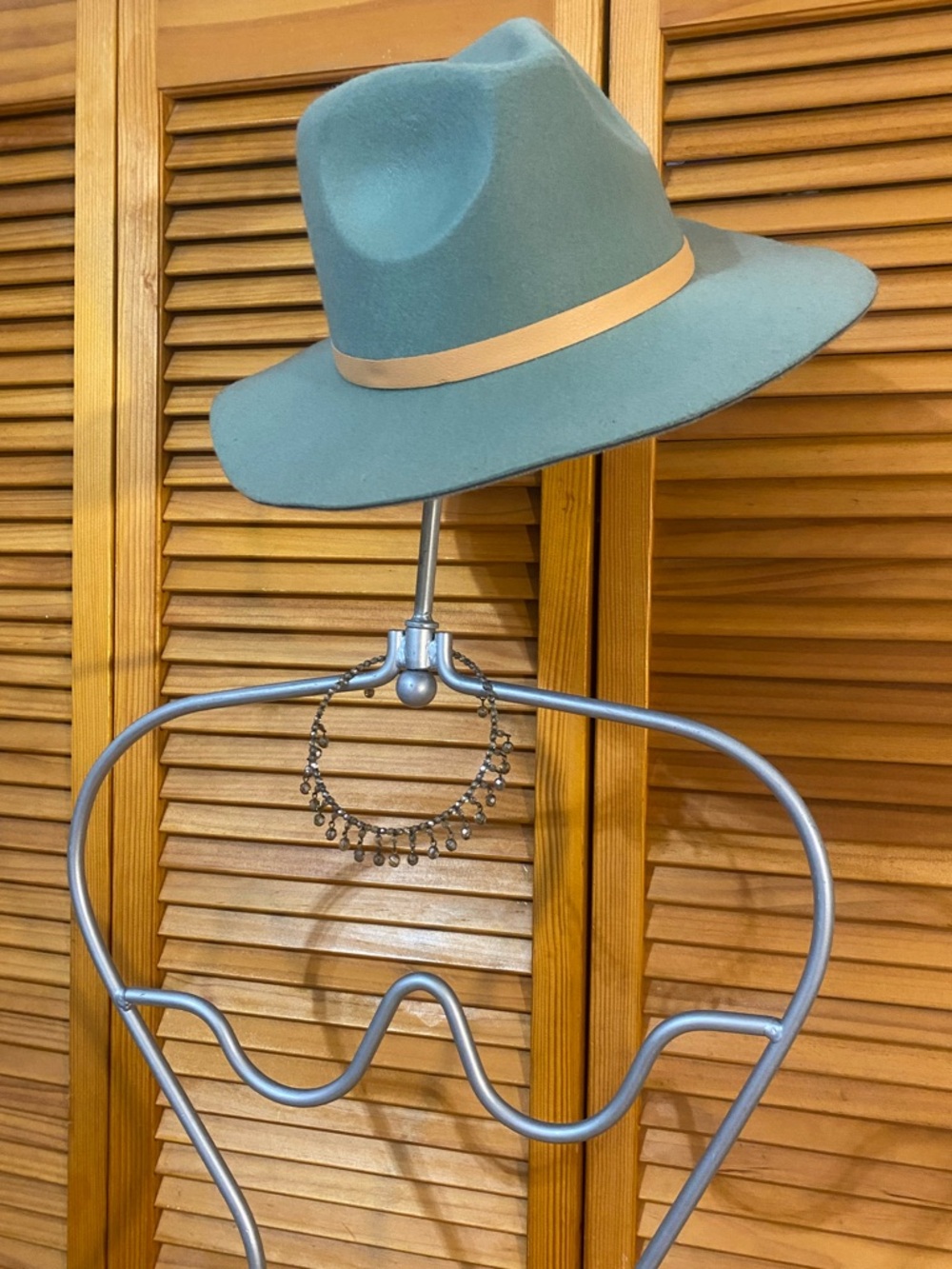 Sleek, green hat